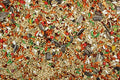 A close-up view of a mix of seeds and grains, part of the Cockatiel and Conure Cuisine bird food.