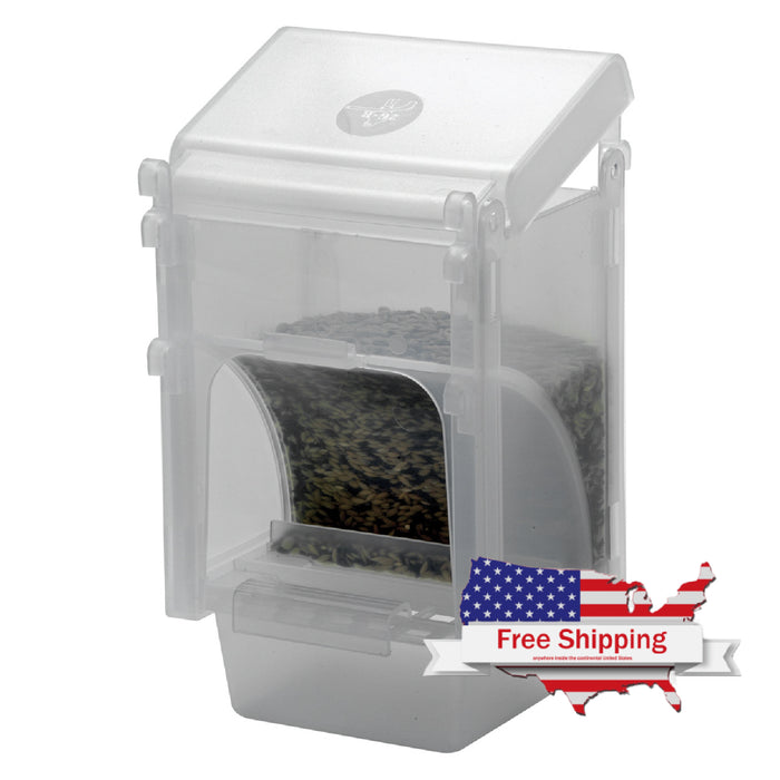 A clear plastic bird feeder hopper with seeds inside, designed for cage or aviary use.
