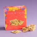 Flouwer Co. No. 1 Artisanal Crackers, packaged in a bright red box with colorful floral illustrations