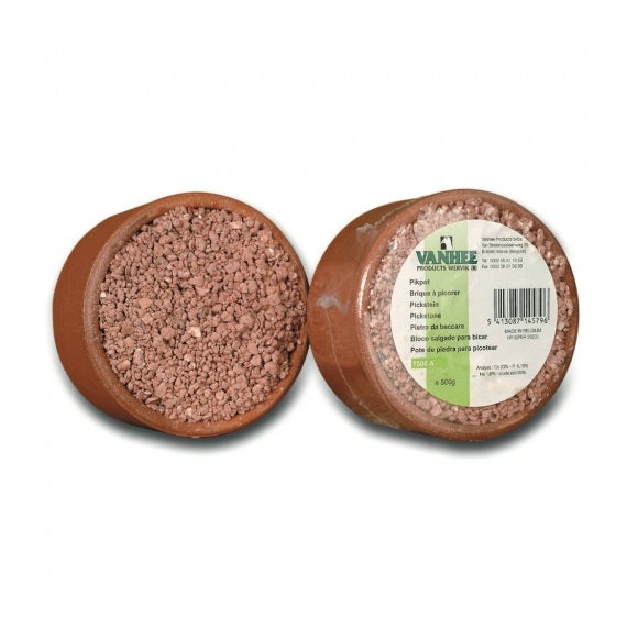 A commercial mineral grit product for pigeons, packaged in a round brown container, with branding and product information visible on the label.