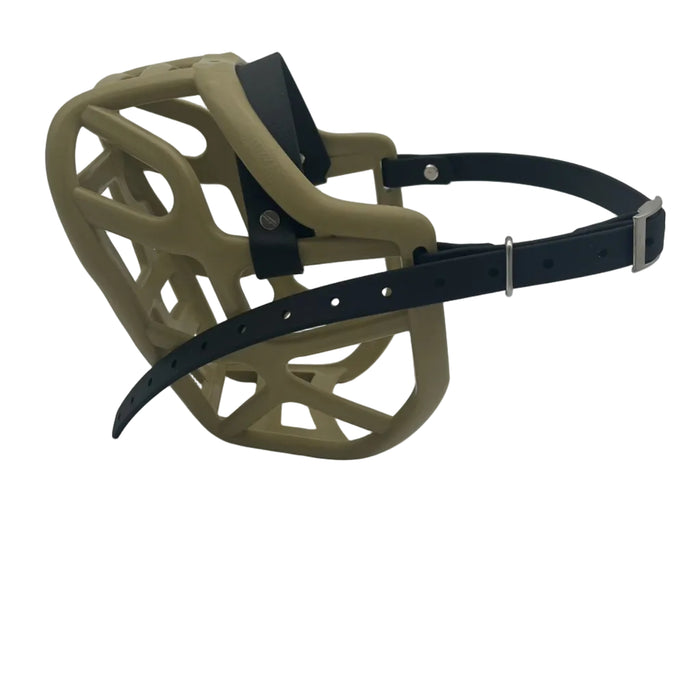 The Muzzle Movement Khaki Harry 2.0 dog muzzle with black straps and nickle hardware with chicago screws on a white background
