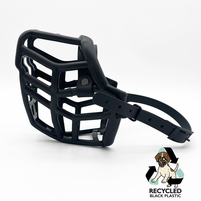 The Muzzle Movement Black Neli dog muzzle with black straps and black hardware with chicago screws on a white background with logo
