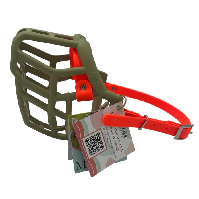 The Muzzle Movement khaki Neli dog muzzle with orange straps and nickle hardware on a white background