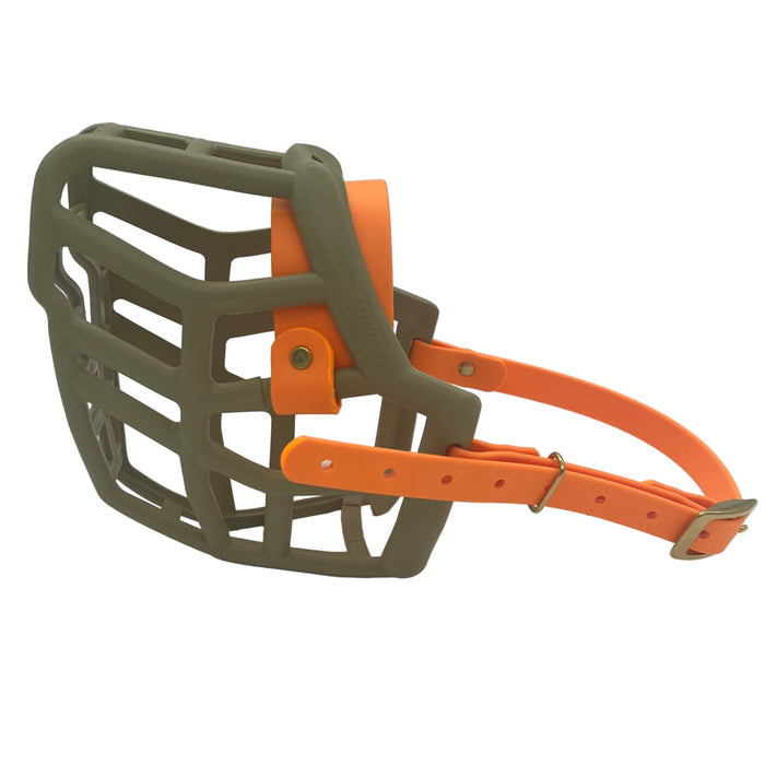 The Muzzle Movement Khaki Neli* dog muzzle with peach straps and brass hardware on a white background