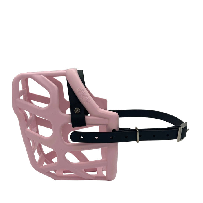 The Muzzle Movement Pastel Pink Taz dog muzzle with black straps and nickle chicago screws on a white background