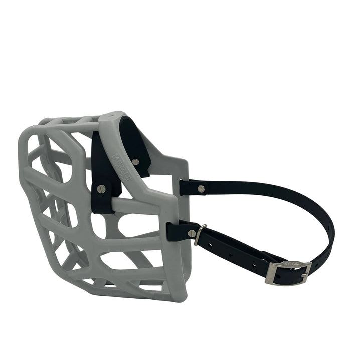 The Muzzle Movement Grey Taz Dog Muzzle with black straps and nickle chicago screws on a white background