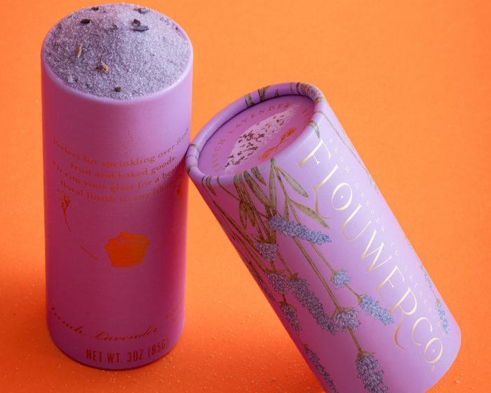 Flouwer Co. French Lavender Finishing Sugar in a lavender-colored, branded cardboard tube