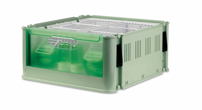 A green plastic transport cage for animals with visible metal drinkers and exterior feeders.
